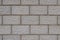 Wall of a house made of gray concrete blocks. Dark background or wallpaper. Low contrast picture. Construction and repair of