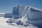 Wall of icebergs frozen in the ice of Antarctica