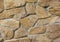 Wall from large stones background texture, stone slate wall concrete grout, rock