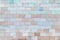 The wall is made of marble turquoise and pale brown tiles. Beautiful stone texture. Empty background.