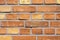 Wall made of orange bricks