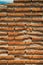 Wall made of small bricks forming a singular pattern