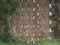 Wall made with terracotta bricks arranged diagonally to create vent holes in an old farm