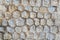 Wall masonry with faceted stones texture