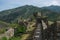 On the wall of medieval fortress Maglic, mountain range at background , Serbia