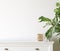 Wall mockup close up in Coastal living room interior with commode, plant and decor