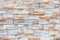 Wall mosaic made of red and beige sandstone tiles