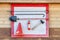 Wall-mounted fire shield with fire-fighting tools. Shovel, hook , axe, cone bucket, fire extinguisher and other equipment hanged