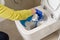Wall mounted toilet cleaning. hotel maid cleans toilet with a scrub brush. woman household service