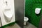 Wall-mounted urinal and men`s toilet in public toilets
