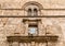 Wall with Mullioned windows with lava stone inlays of the Palace Steri Chiaramonte, Palermo, Sicily, Italy