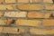 Wall of new refractory bricks closeup yellow .