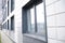 wall of office building made of metal plates with windows. Detail of modern residential building windows on ceramic