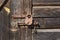 The wall of an old wooden barn built from hand-hewn pine logs.