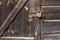 The wall of an old wooden barn built from hand-hewn pine logs.