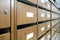 Wall of old wooden postal mailboxes and lockers in perspective v