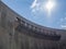 Wall, overflow and sun at impressive Katse Dam hydroelectric power plant in Lesotho, Africa