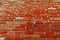 Wall piled of red old brick