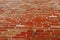 Wall piled of red old brick