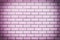 Wall of purple bricks. The texture of the brickwork.
