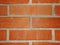 Wall of red brick with clay mortar fragment of masonry wood-fired oven .