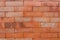A wall of red bricks arranged in a specific pattern
