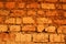 Wall of red earth bricks