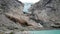 Wall Of Rocks With The Glacier Above And The Lake Below