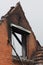 Wall of a ruined of a burned down residential building after a fire