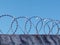 Wall with spiral barbed wire, Razor wire fencing