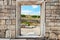 Wall of stones with a hole under the door. Cultural monument Che