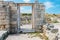 Wall of stones with a hole under the door. Cultural monument Che