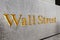 Wall Street golden inscription on a building.