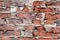 Wall texture of old red dilapidated brick