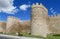 Wall, tower and bastion of Avila, Spain, made of yellow stone bricks