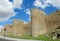 Wall, tower and bastion of Avila, Spain, made of yellow stone bricks