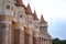 Wall with towers of the medieval castle of Corvin, Romania