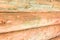 Wall wooden pine logs light beige large building material rustic base horizontal close-up ribbed canvas