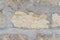 Wall of yellow shell rock blocks, natural stone, textural background, close-up