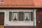 WALLDORF, GERMANY - JUNE 4, 2017: A close-up of german village residential house, its windows with old wooden shutters