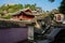 Walled ancient tile-roofed buildings at hill foot in morning