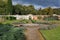 Walled kitchen garden with a pathway and a circular fountain