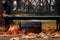 wallet lying near a park bench with fallen autumn leaves around