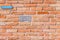 Wallpaper of an antique red brick wall with letterbox