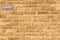 Wallpaper of an antique sepia brick wall