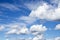 Wallpaper with high cumulus clouds on blue spring sky