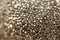 Wallpaper metallic granular phone.Shiny grainy texture. background in bronze tones.wall texture