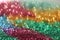 Wallpaper phone shining glitter.Glitter radiance surface. multicolored variegated glitter with shining bokeh.Festive