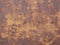 Wallpaper texture rusty metal surface creating different shapes in different shades of brown