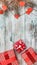 Wallpaper of white wood, vertical. Fir tree with hearts and red gifts. Space for wishes with winter, xmas, New Year and Christmas.